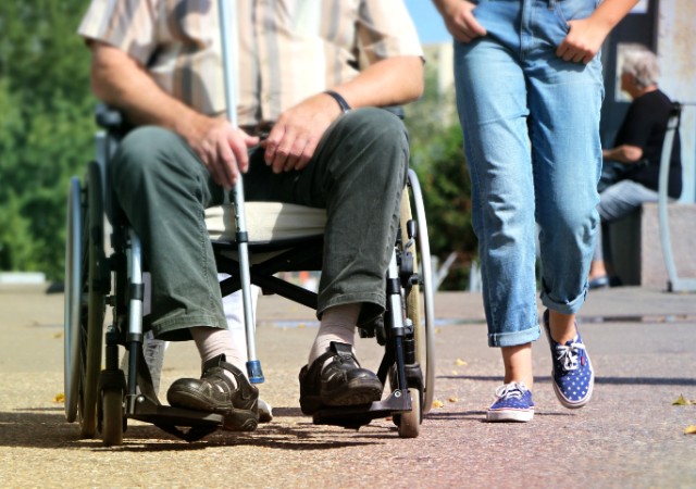 young woman offering care to alzheimer's patient