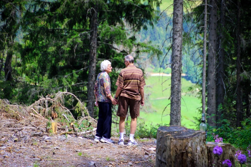 two seniors walking together