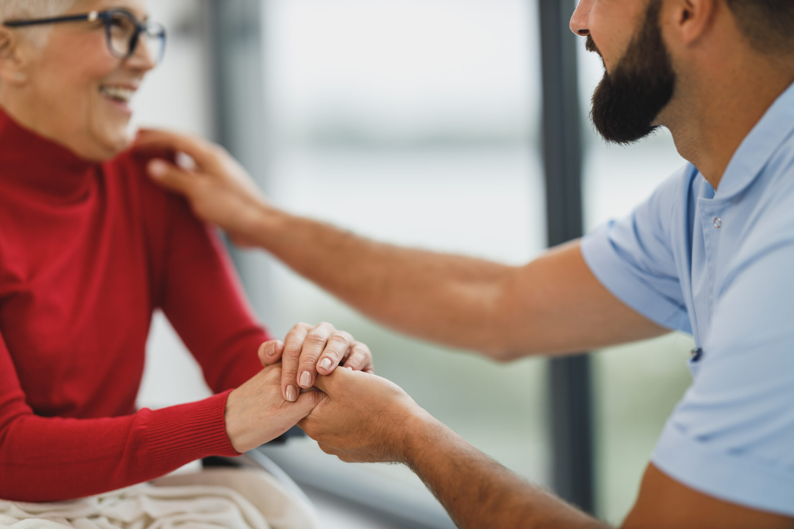 Caregiver Holding Hand of Patient