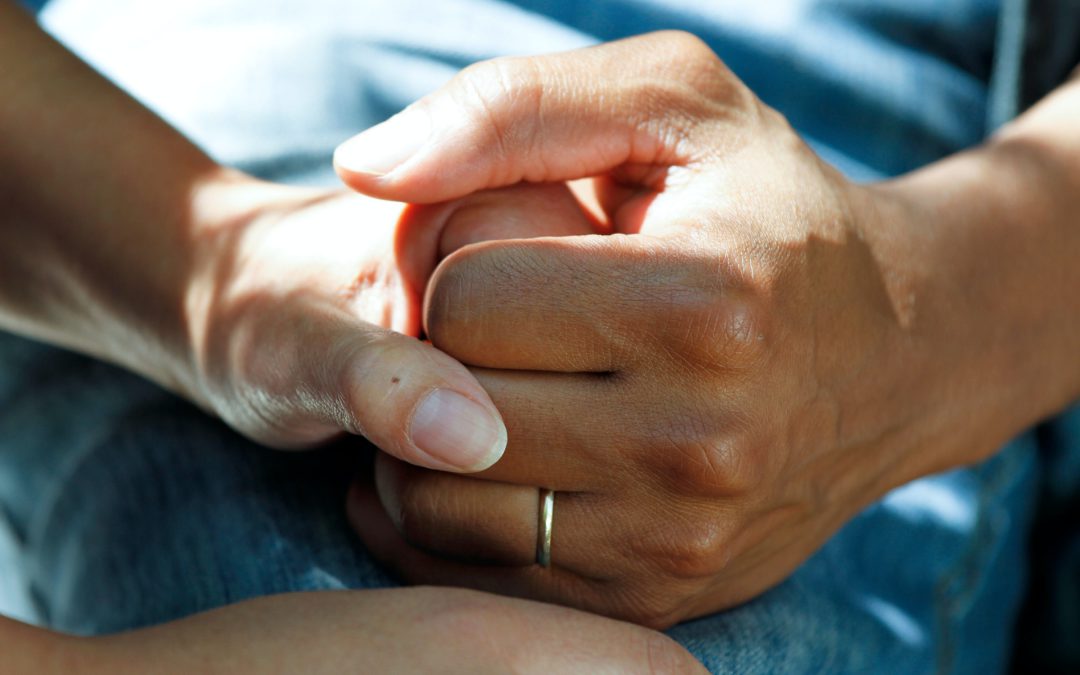 Holding Hands of Patient