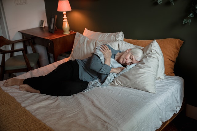 Elderly Woman Sleeping In Bed