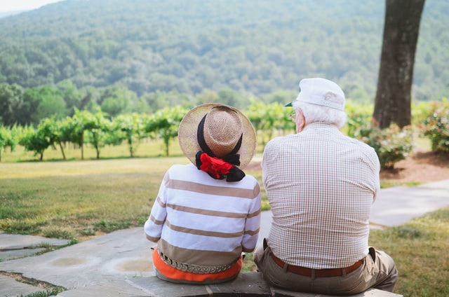 Elderly Couple Sitting On a Bench