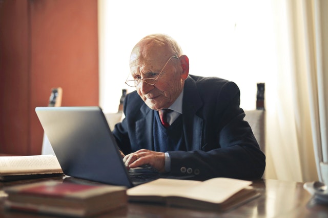 Elderly Man Using Laptop