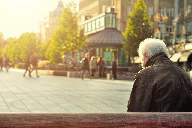 Retired Man Sitting On a Bench