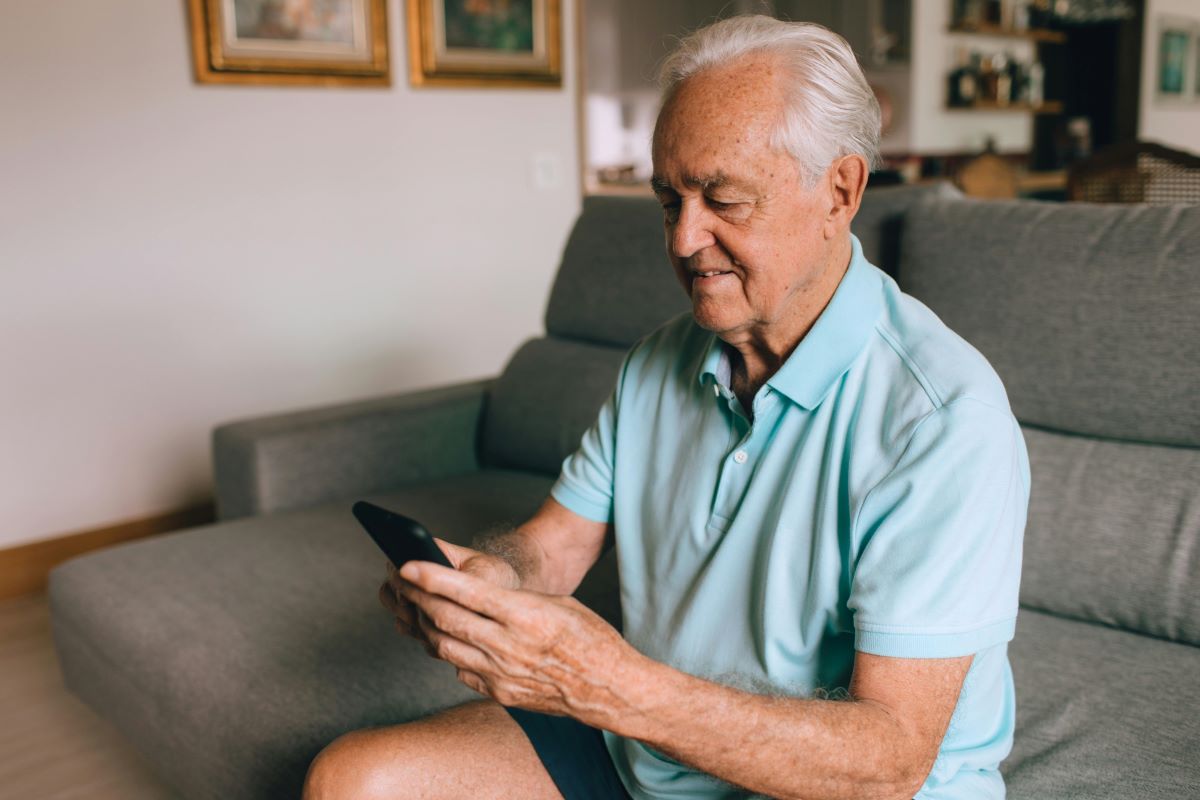 Elderly man on smart phone